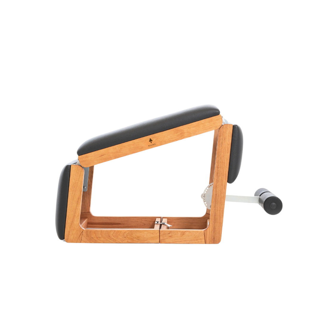 A multifunctional exercise bench made with natural cherry wood and premium Italian leather, for a broad range of exercises. NOHRD TriaTrainer