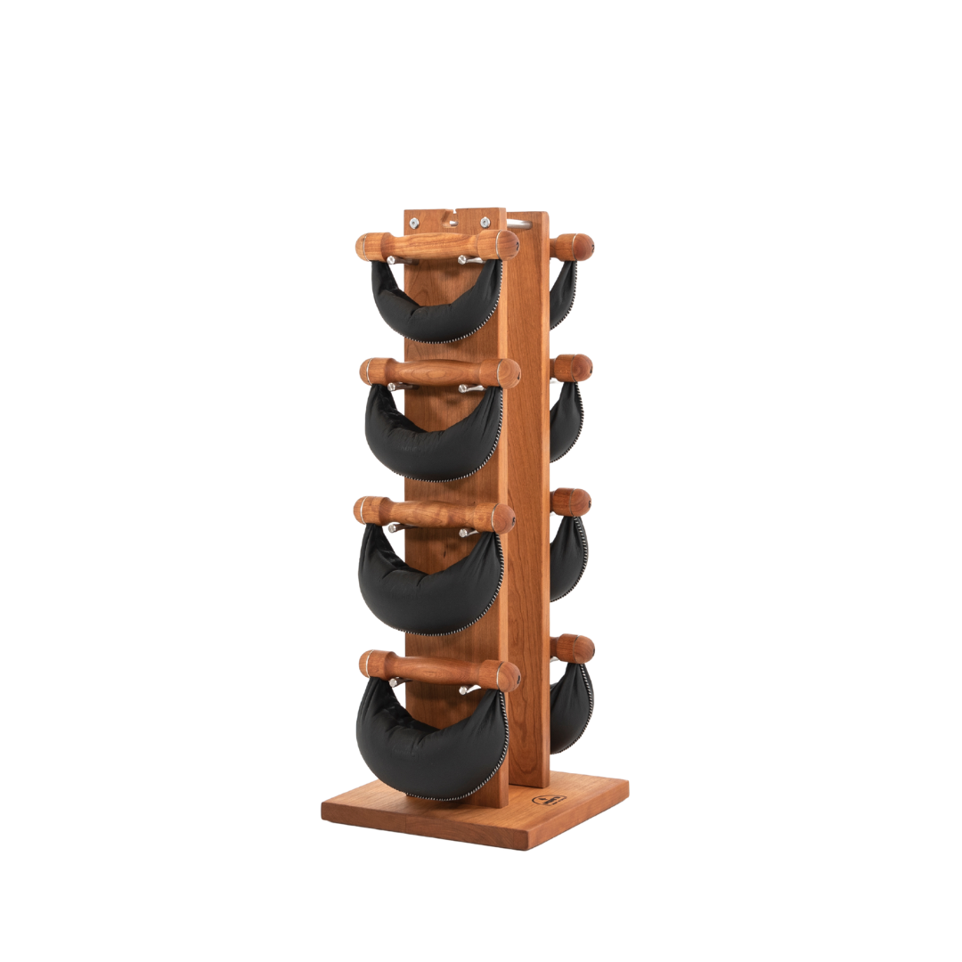 Six black leather swingbell are neatly arranged on a cherry wooden rack, highlighting craftsmanship and simplicity in design. NOHRD Swing Tower - Leather Dumbbell Set