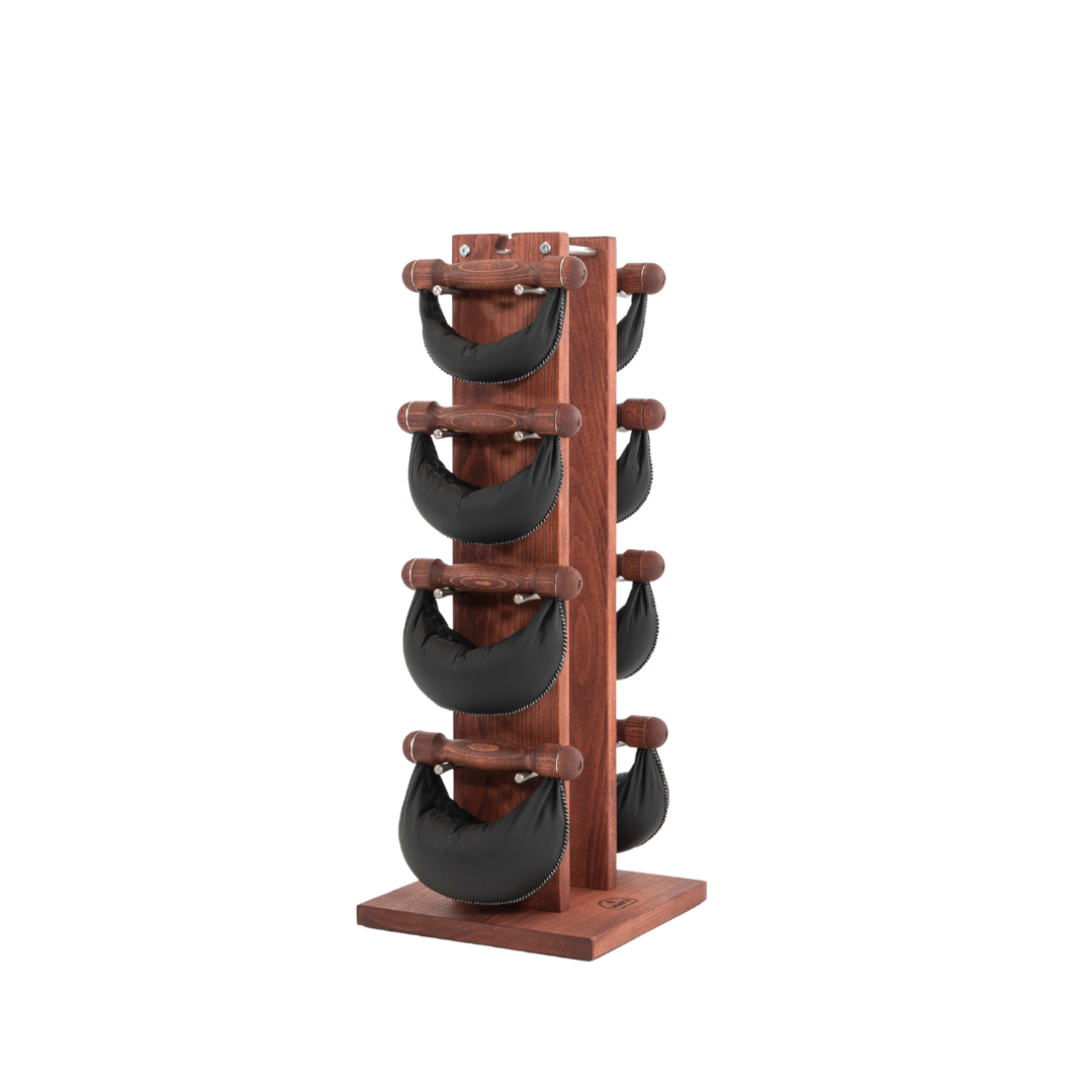 Six black leather swingbell are neatly arranged on a club wooden rack, highlighting craftsmanship and simplicity in design. NOHRD Swing Tower - Leather Dumbbell Set