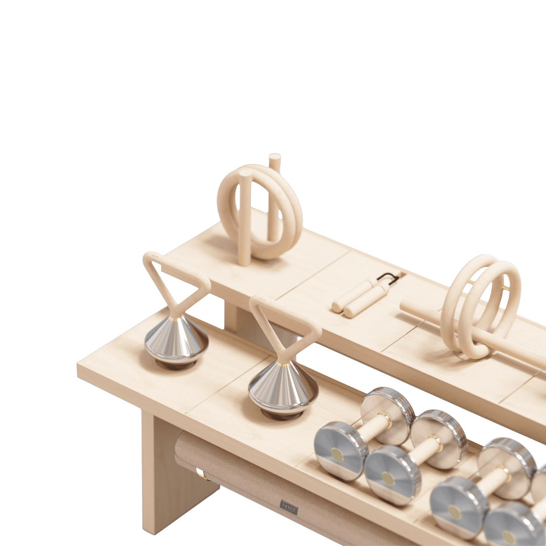 Detail view of storage furniture with brass accents and neatly organized fitness tools.