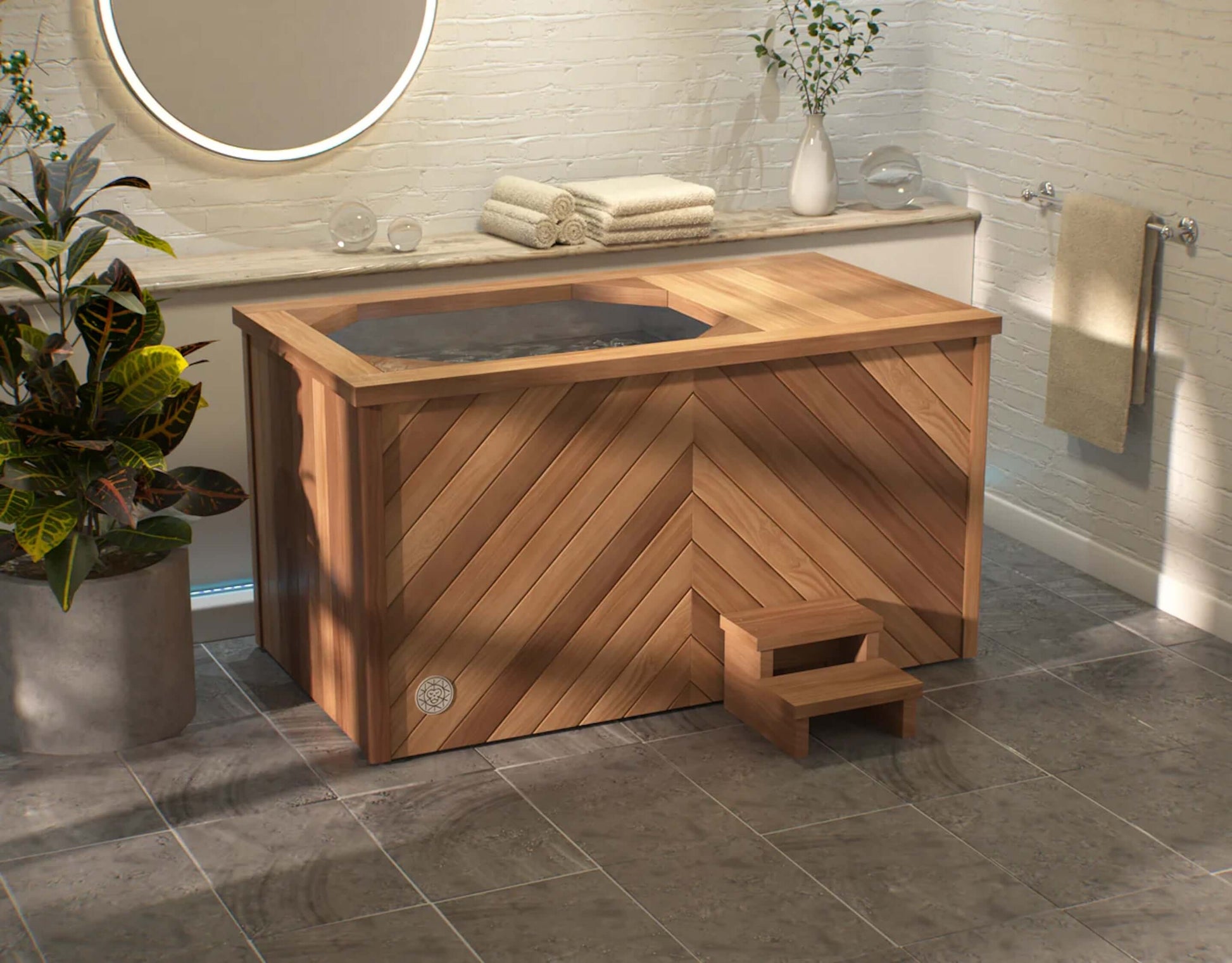A premium cold therapy ice bath handcrafted with herringbone natural cedar wood finish placed in a wellness center. Brass Monkey - Ice Bath