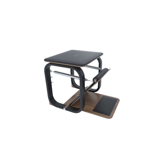 A luxury fitness equipment, Pilates wunda chair made with natural wood and black premium Italian leather, PENT. PILATES - WUNDA CHAIR