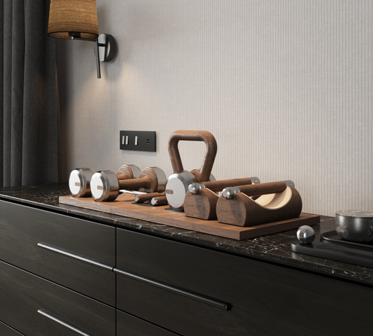 Luxury gym equipment set with push-up bars, a kettlebell, set of dumbbells, and a jumping rope on a premium wood stand placed in hotel room. With wood materials in natural walnut and stainless steel. PENT. DEHA - Set of Fitness Equipment