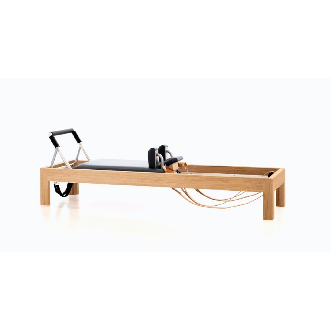 Luxury reformer combining oak wood, birch, and precision craftsmanship.