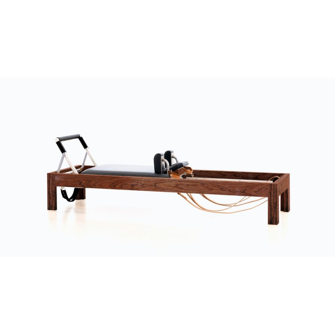 Luxury reformer combining walnut wood, birch, and precision craftsmanship.