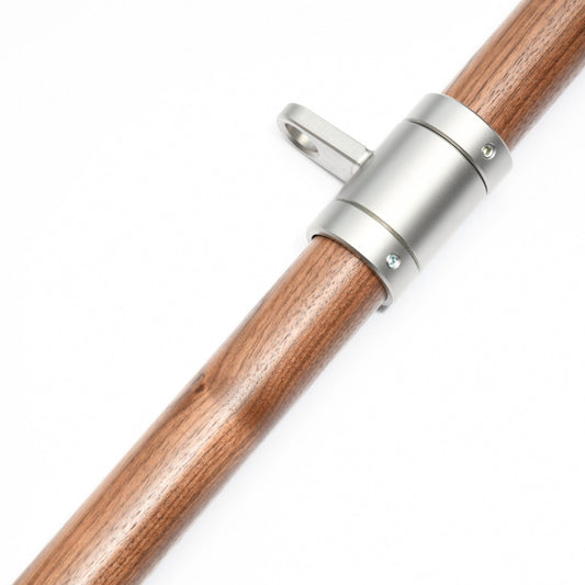 A metallic connecting natural walnut wood bar with a center clasp, featuring a sleek, cylindrical design, used for workout exercises. Stil-Fit Functional Trainer Accessories - Bicep & Tricep Bar