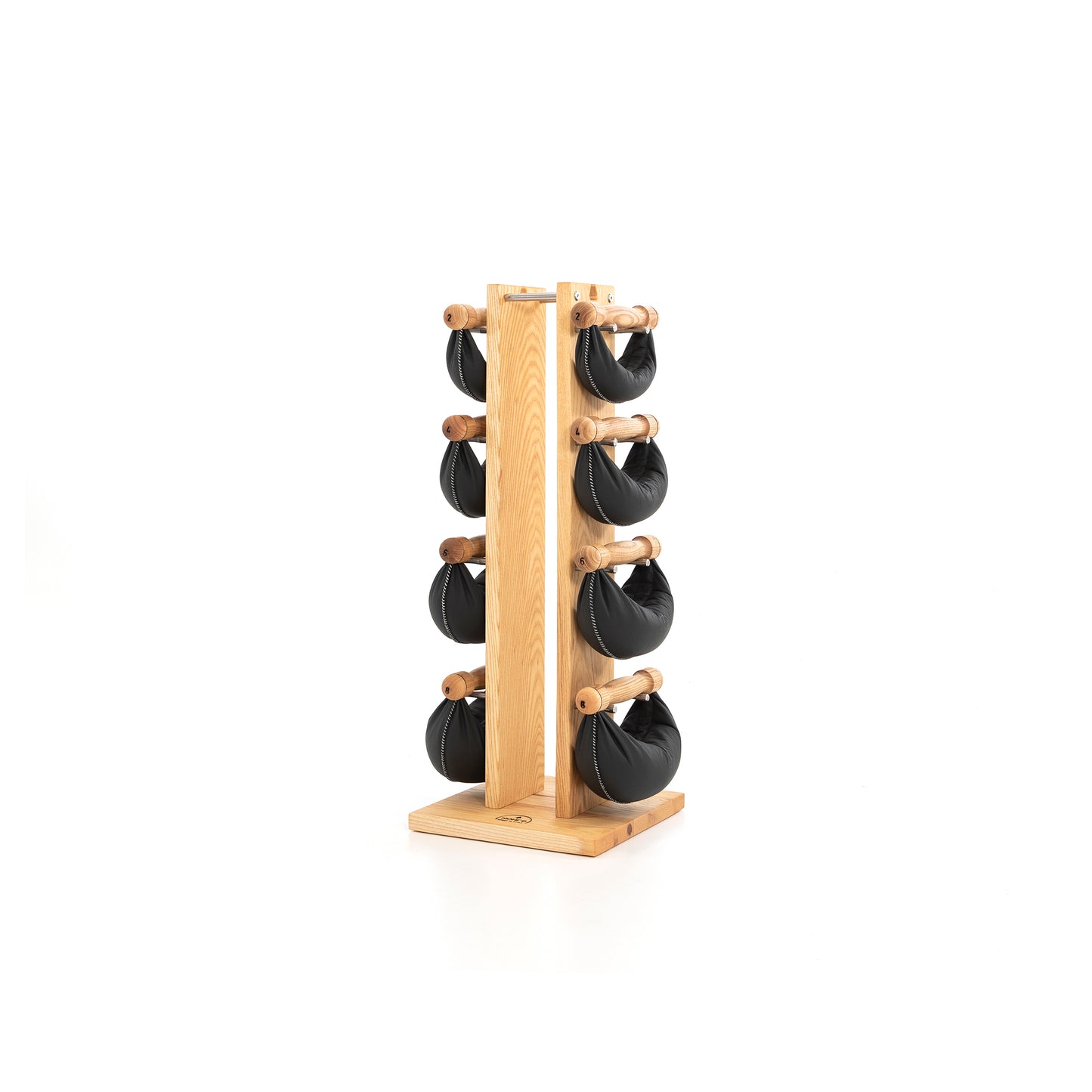 Sideview of six black leather swingbell are neatly arranged on a natural ash wooden rack, highlighting craftsmanship and simplicity in design. NOHRD Swing Tower - Leather Dumbbell Set