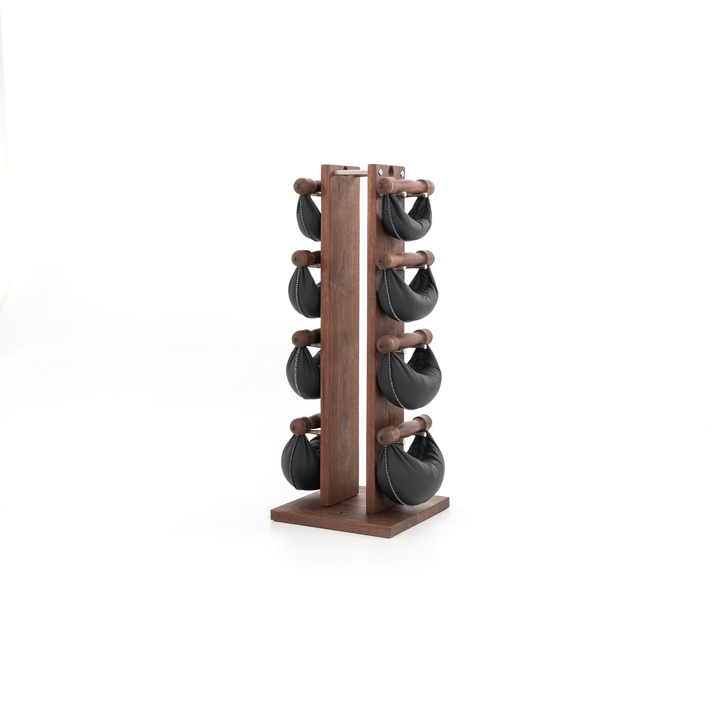Sideview of six swingbell with black leather are neatly arranged on walnut wooden rack, highlighting craftsmanship and simplicity in design. NOHRD Swing Tower - Leather Dumbbell Set