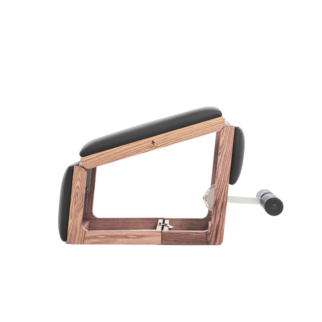 A multifunctional exercise bench made with natural vintage wood and premium Italian leather, for a broad range of exercises. NOHRD TriaTrainer