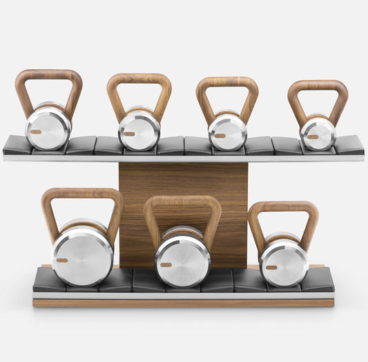 PENT Lova Luxury Kettlebells on a horizontal stand, featuring customisable options in various weight ranges, wood types, and leather combinations.