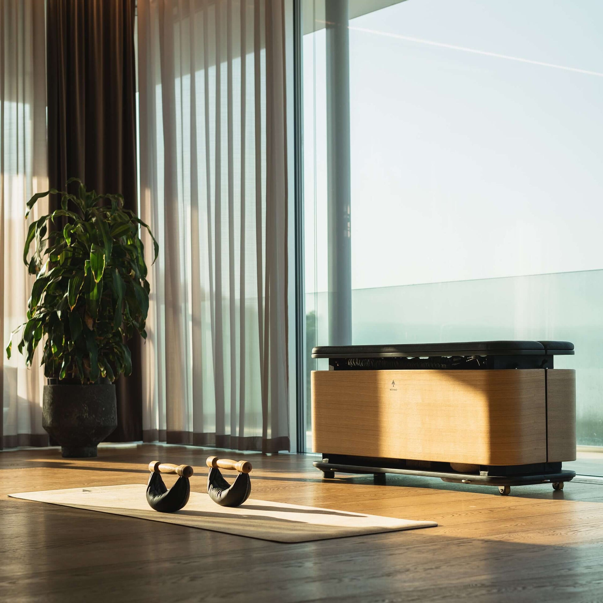 Luxury fitness equipment. NOHRD StepBox placed in a home gym, doubling as a workout station and stylish storage unit.