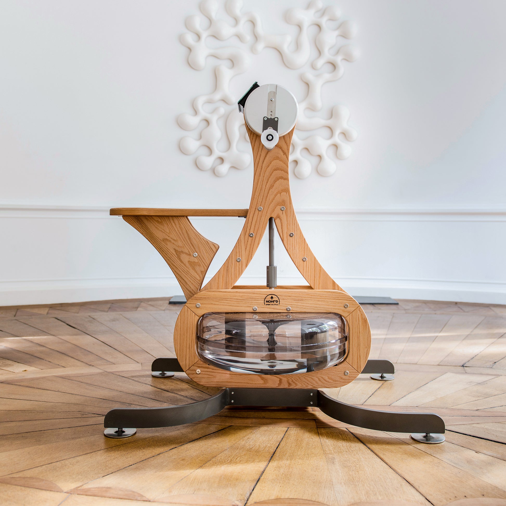 Luxury gym equipment, made with natural oak wood, in a luxury fitness space. NOHRD WaterGrinder.