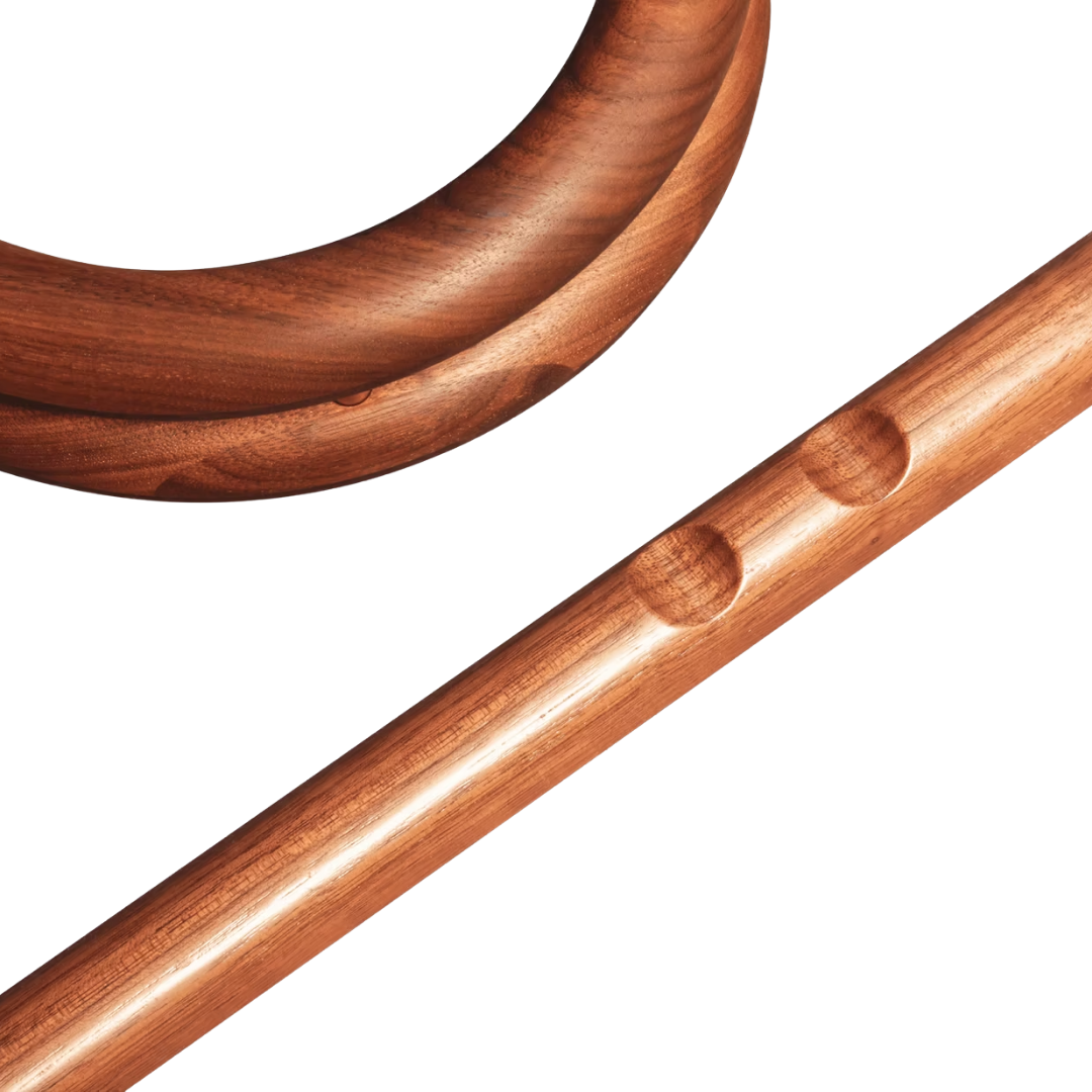 Close-up of handcrafted wooden abdominal roller designed for core exercises.