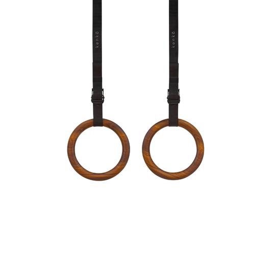 Walnut wood finish kenko gym ring  showcasing deep brown tones and rich grain lines.