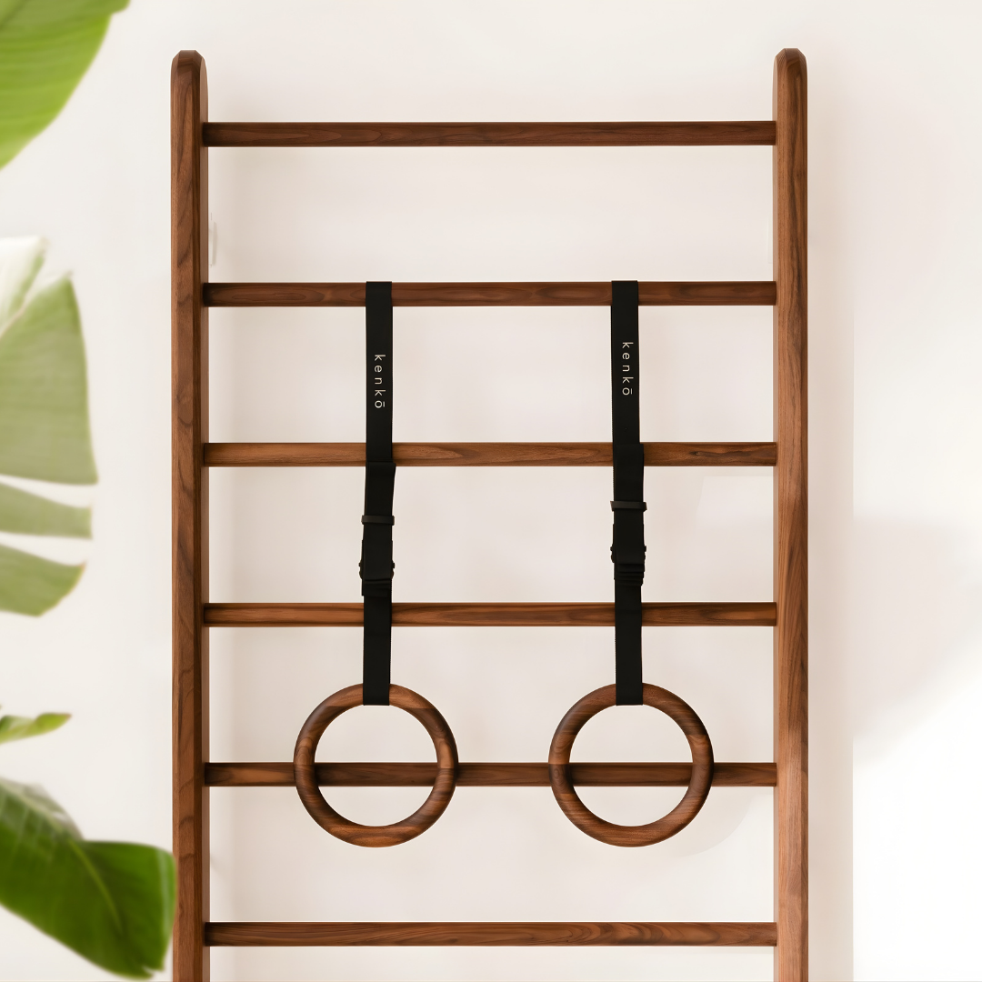 Smooth wooden gym rings showcasing the natural grain.
