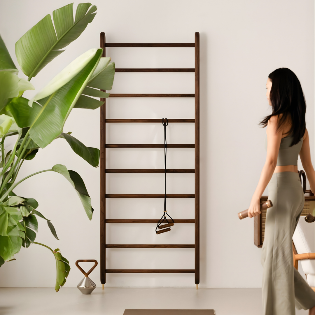 Contemporary home fitness wall bar in solid wood, plain backdrop.