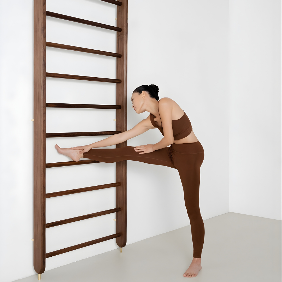 Customer performing flexibility exercises on kenko wallbar.