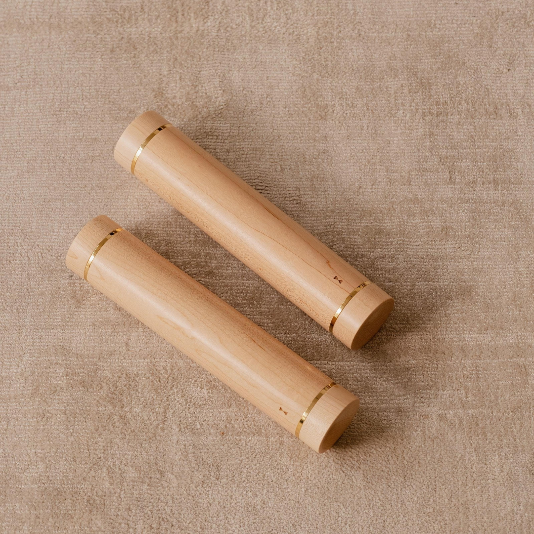 Elegant detail of aerobic dumbbell with ergonomic design for controlled grip.