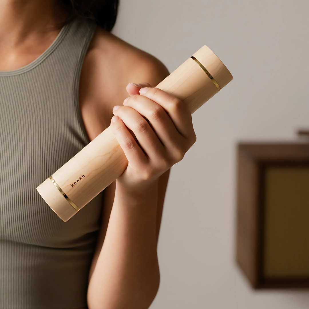User performing light upper body exercises with maple-handled aerobic dumbbells.