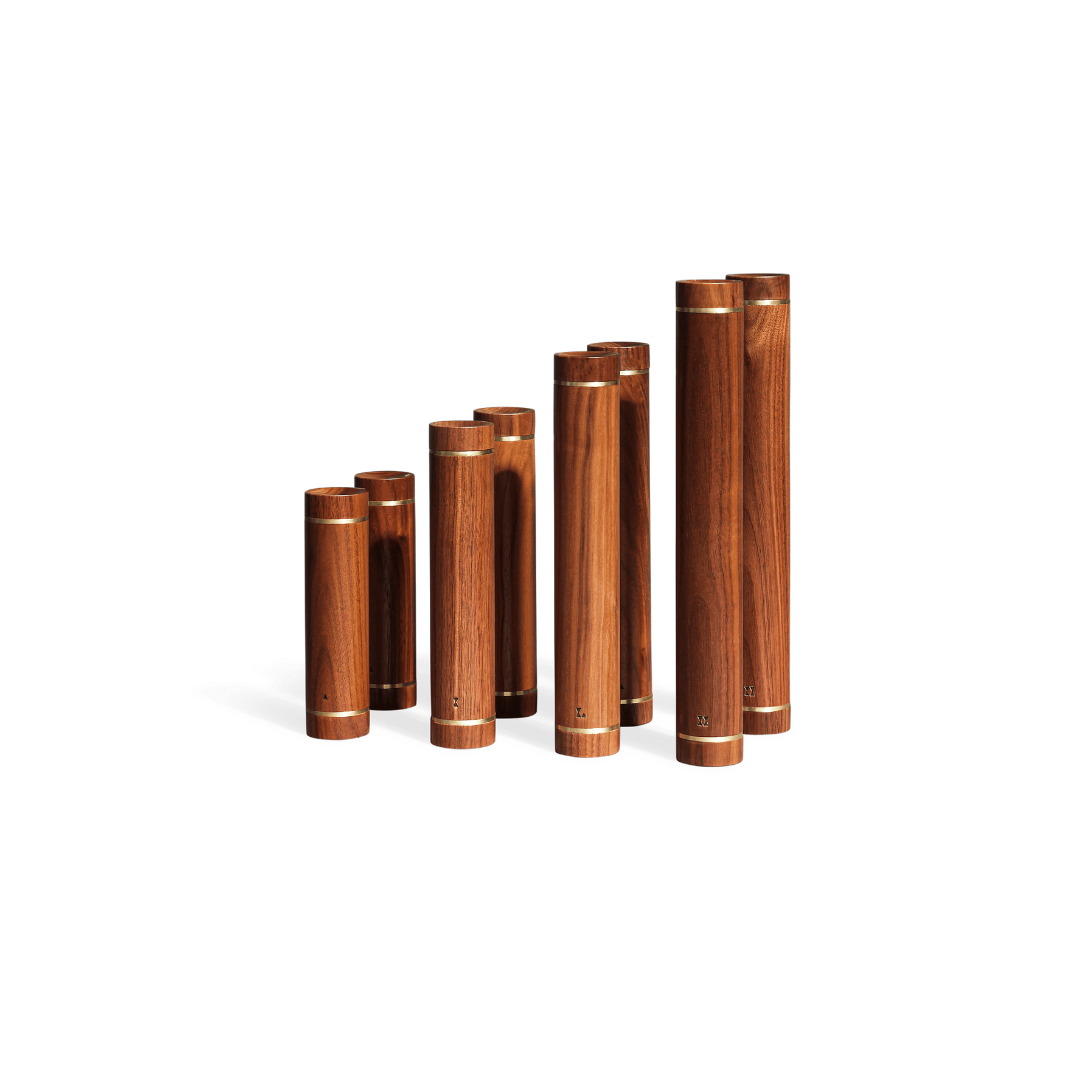 Luxury dumbbells combining solid wood or polished steel with refined craftsmanship.