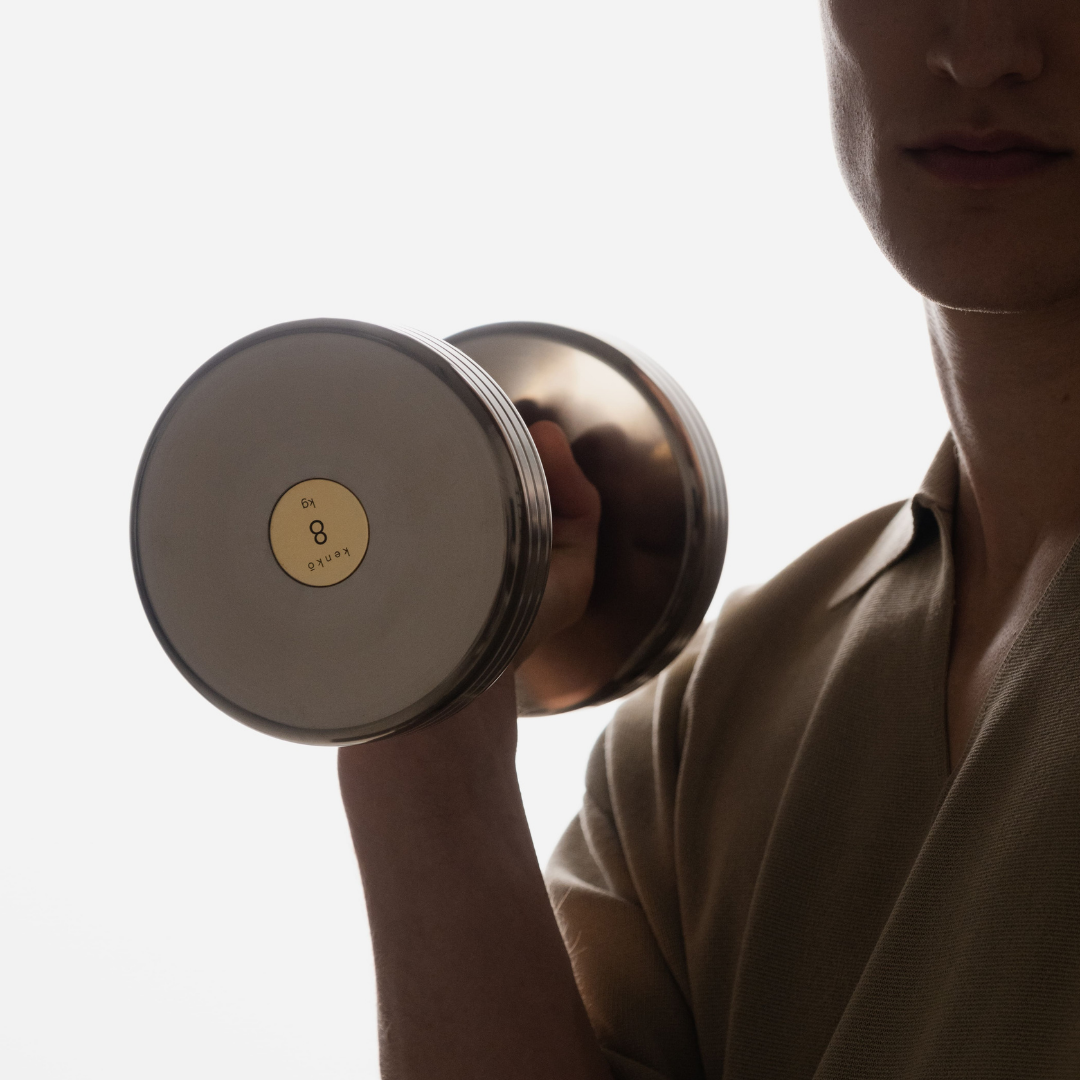 Refined detail of turned stainless steel core and gold-plated brass fittings.