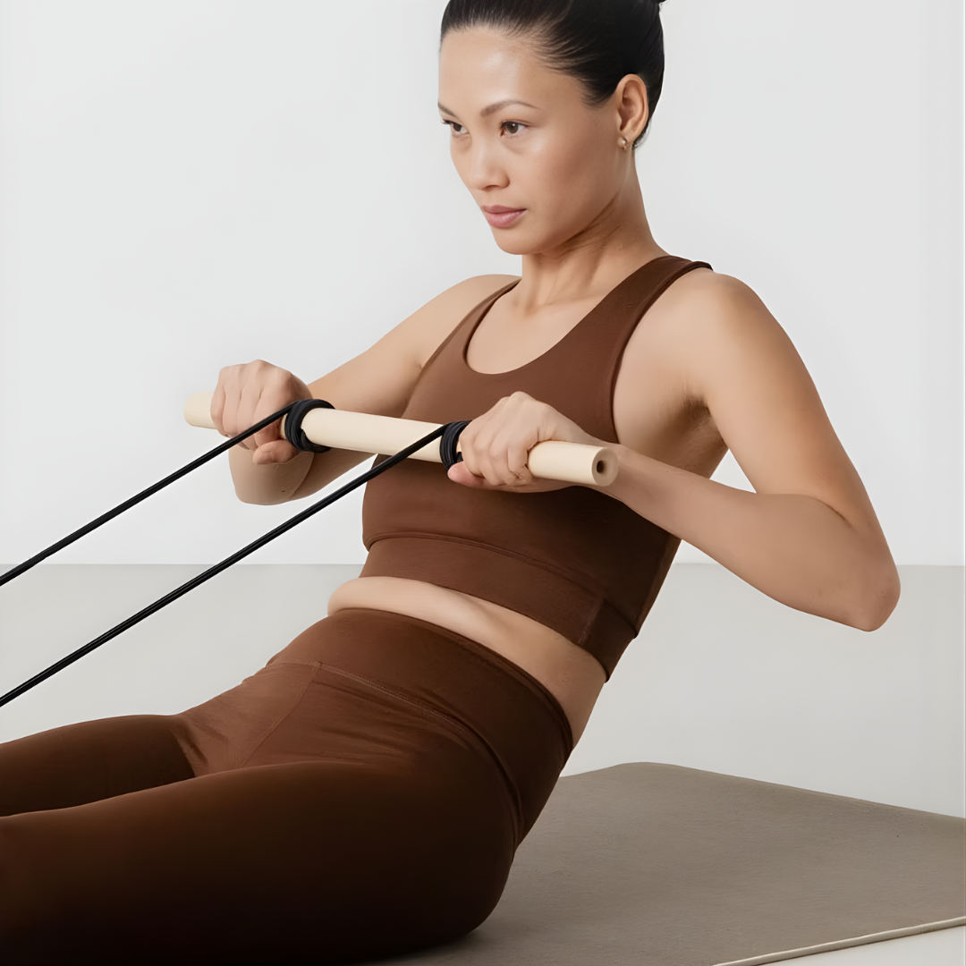 User stretching the elastic band of the Expander Big with arms extended forward.