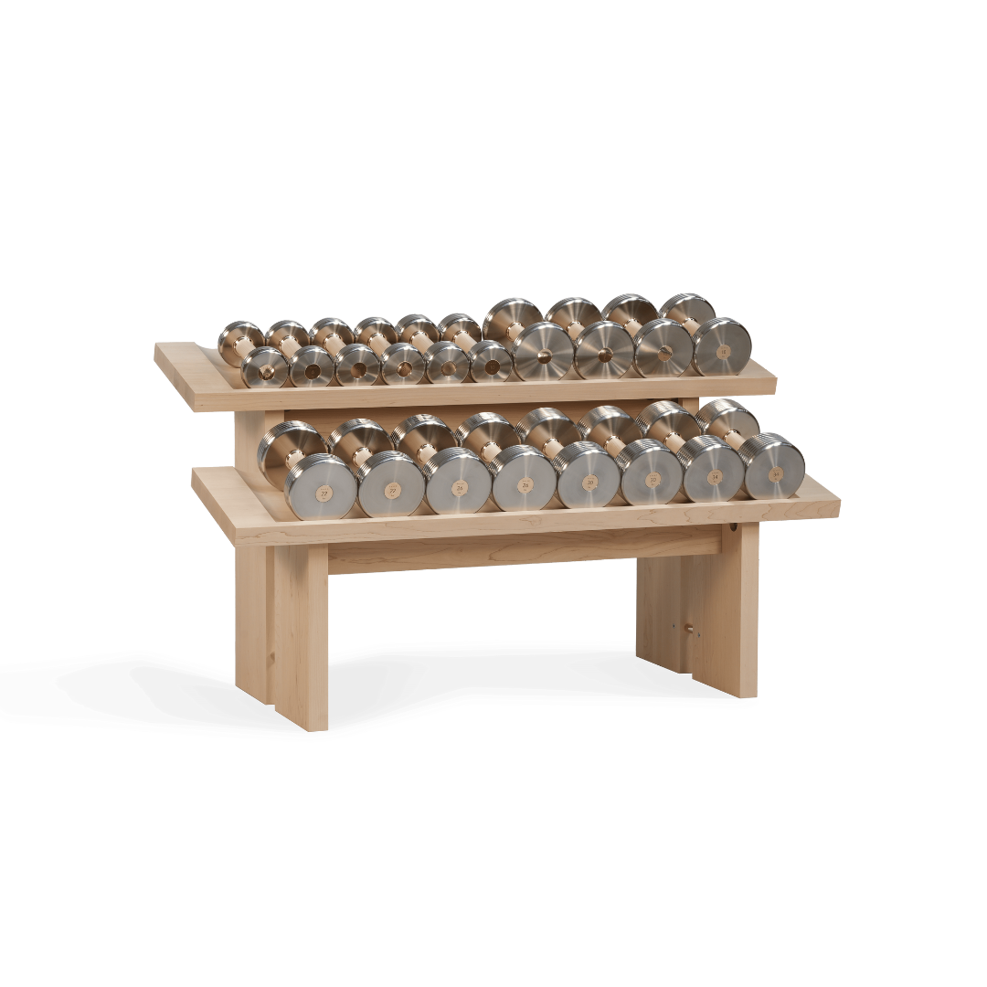 Luxury horizontal dumbbell rack crafted from solid maple with brass details.