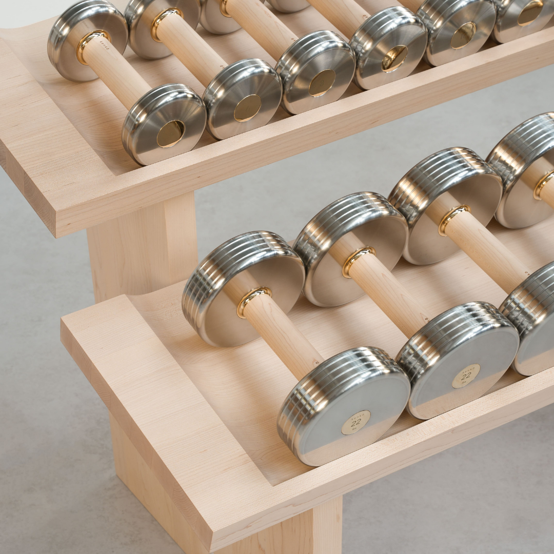 Refined detail of brass accent contrasting with solid maple wood.