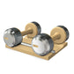 Luxury dumbbells made with natural ash wood and stainless steel on natural ash wooden stand. Available in weights ranging between 2 - 30kg. PENT. COLMIA - Luxury Dumbbells on Wooden Stand
