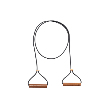 Kenko Expander Double with solid wood handles and elastic band on plain background