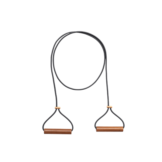 Kenko Expander Double with solid wood handles and elastic band on plain background