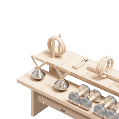 Detail view of storage furniture with brass accents and neatly organized fitness tools.