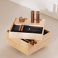 Minimalist home gym kit with curated workout tools housed in sleek wooden box.