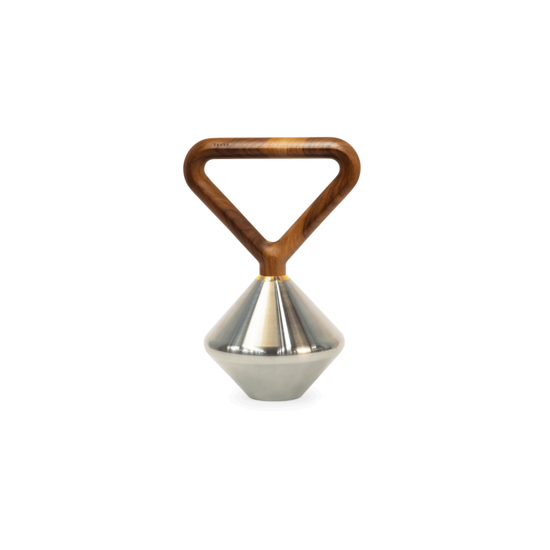 Kenko Kettlebell – minimalist stainless steel kettlebell with walnut wood handle and brass detailing.