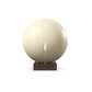 Luxury fitness equipment, fitness ball wrapped in luxurious leather and paired with a compact wooden stand. Customize in beige base leather, white accent leather and dark walnut wood. PENT. MESNA