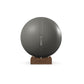 Luxury fitness equipment, fitness ball wrapped in luxurious leather and paired with a compact wooden stand. Customize in grey base leather, grey accent leather and natural walnut wood. PENT. MESNA