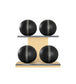 Luxury fitness equipment, 4 leather medicine ball on horizontal wooden stand, handcrafted with premium Italian black base leather, grey accent leather and natural ash wood. PENT. MOXA Set