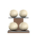 Luxury fitness equipment, 4 leather medicine ball on horizontal wooden stand, handcrafted with premium Italian beige base leather, beige accent leather and natural walnut wood. PENT. MOXA Set