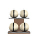 Luxury fitness equipment, 4 leather medicine ball on horizontal wooden stand, handcrafted with premium Italian beige base leather, black accent leather and natural walnut wood. PENT. MOXA Set