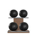 Luxury fitness equipment, 4 leather medicine ball on horizontal wooden stand, handcrafted with premium Italian black base leather, black accent leather and natural walnut wood. PENT. MOXA Set