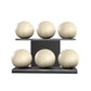 Six beige leather medicine balls with beige accent leather, arranged on two shelves made of black ash wood. PENT. MOXA Set Ultimate - Set of 6 Medicine Balls on Horizontal Wooden Stand