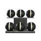 Six black leather medicine balls with beige accent leather, arranged on two shelves made of black ash wood. PENT. MOXA Set Ultimate - Set of 6 Medicine Balls on Horizontal Wooden Stand