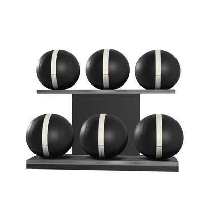 Six black leather medicine balls with white accent leather, arranged on two shelves made of black ash wood. PENT. MOXA Set Ultimate - Set of 6 Medicine Balls on Horizontal Wooden Stand