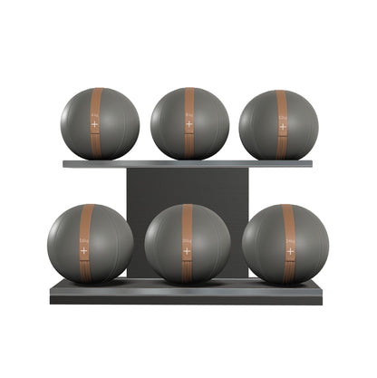 Six grey leather medicine balls with brown accent leather, arranged on two shelves made of black ash wood. PENT. MOXA Set Ultimate - Set of 6 Medicine Balls on Horizontal Wooden Stand