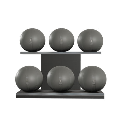 Six grey leather medicine balls with grey accent leather, arranged on two shelves made of black ash wood. PENT. MOXA Set Ultimate - Set of 6 Medicine Balls on Horizontal Wooden Stand
