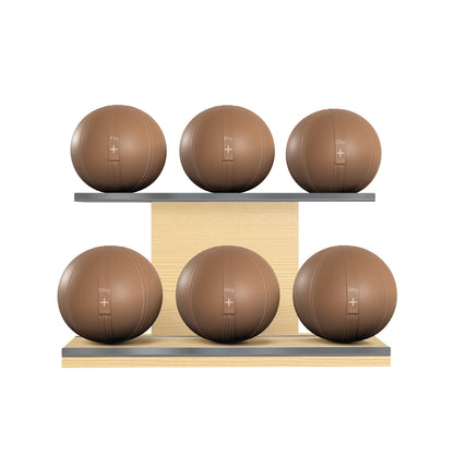 Six brown leather medicine balls with brown accent leather, arranged on two shelves made of natural ash wood. PENT. MOXA Set Ultimate - Set of 6 Medicine Balls on Horizontal Wooden Stand