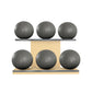 Six grey leather medicine balls with grey accent leather, arranged on two shelves made of natural ash wood. PENT. MOXA Set Ultimate - Set of 6 Medicine Balls on Horizontal Wooden Stand