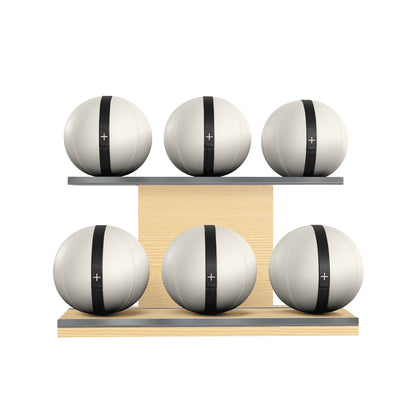 Six white leather medicine balls with black accent leather, arranged on two shelves made of natural ash wood. PENT. MOXA Set Ultimate - Set of 6 Medicine Balls on Horizontal Wooden Stand