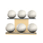 Six white leather medicine balls with white accent leather, arranged on two shelves made of natural ash wood. PENT. MOXA Set Ultimate - Set of 6 Medicine Balls on Horizontal Wooden Stand