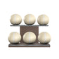 Six beige leather medicine balls with beige accent leather, arranged on two shelves made of natural walnut wood. PENT. MOXA Set Ultimate - Set of 6 Medicine Balls on Horizontal Wooden Stand